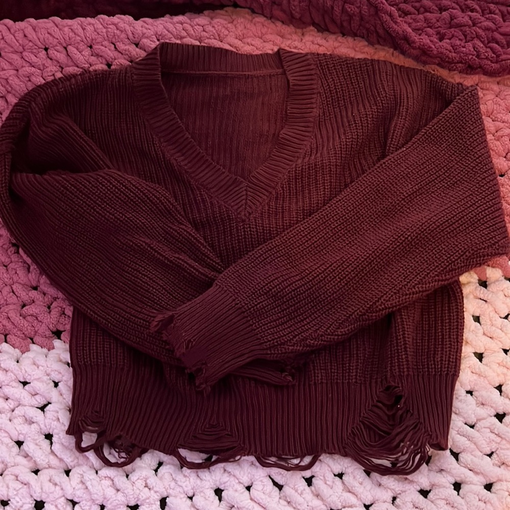 It’s a Knitted Maroon Sweater, Size M, never been worn